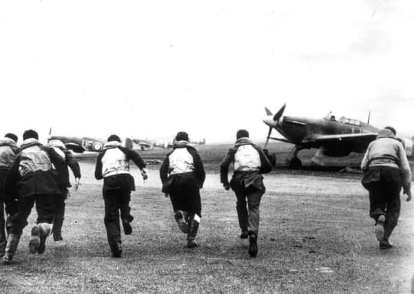 RAF pilots scramble for their Hawker Hurricanes during the Battle of Britain