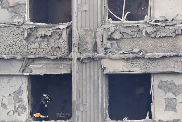 Fire service personnel inside Grenfell Tower. Picture: Rick Findler/PA Wire