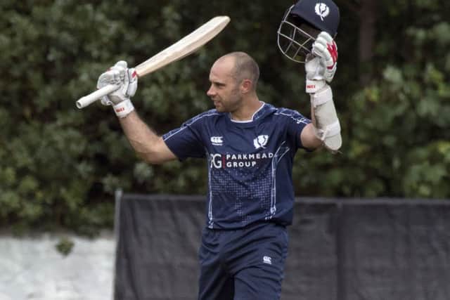Scotland captain Kyle Coetzer celebrates his century. Picture: Donald MacLeod