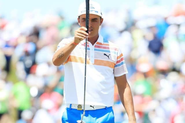 Rickie Fowler lines up a putt on the ninth green as he played his way to the top of the leaderboard with a flawless 65. Picture: Andrew Redington/Getty