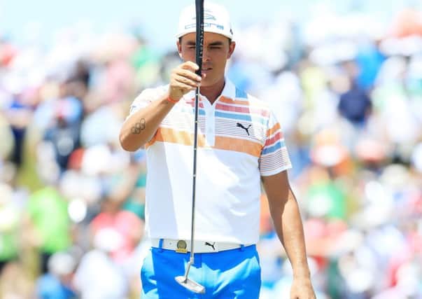 Rickie Fowler lines up a putt on the ninth green as he played his way to the top of the leaderboard with a flawless 65. Picture: Andrew Redington/Getty