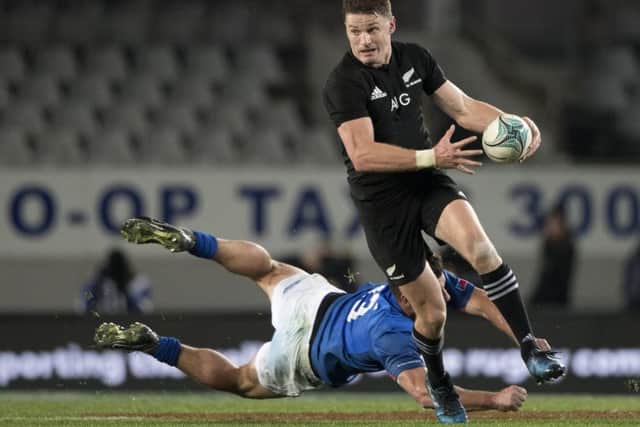 All Blacks fly-half Beauden Barrett runs past Samoa's Kieron Fonotia. Picture: Brett Phibbs/New Zealand Herald via AP