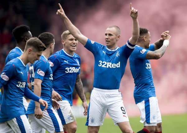 Rangers No 9 Kenny Miller says pre-season training has been different this summer because the players were barely away before they were back. Photograph: Ross Parker/SNS