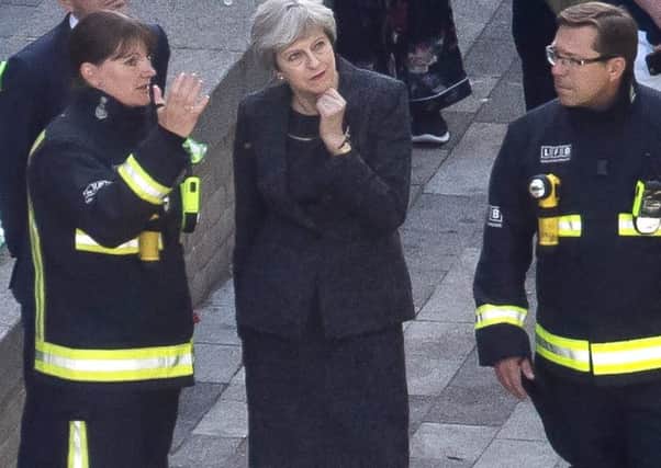 Prime Minister Theresa May spoke to fire services chiefs at Grenfell Tower on Thursday, but avoided residents. Photograph: Dan Kitwood/Getty Images