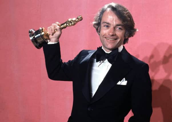 John G Avildsen wins the Oscar for best director for Rocky in 1977 (AP)