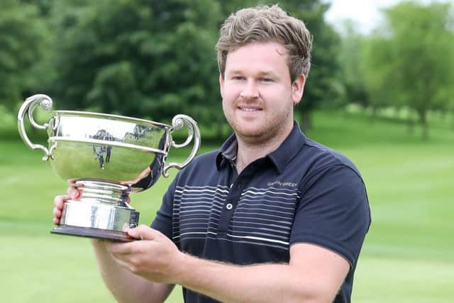 Paul O'Hara holds the trophy aloft after his victory in the PGA's flagship event.