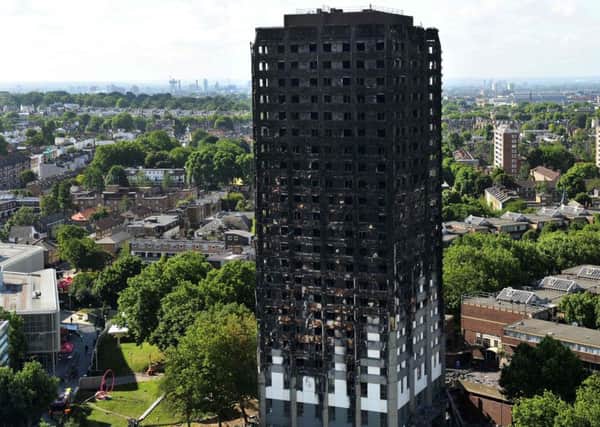The contractors who added cladding to the Grenfell tower block could have made it fire-resistant for just Â£5,000 extra. Photograph: AFP/Getty Images