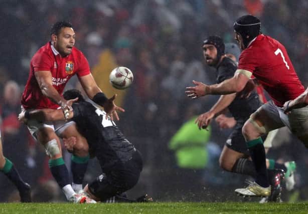 British and Irish Lions' Ben Te'o offloads the ball to Sean O'Brien during the Tour match at the Rotorua International Stadium. Picture: David Davies/PA Wire