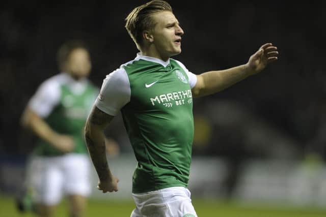 Jason Cummings celebrates after giving Hibs an early lead against Dundee United last season. The striker scored 55 times for the Easter Road club. Picture: Neil Hanna