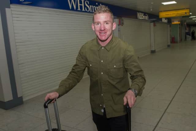 Jonny Hayes arrives at Glasgow airport ahead of his move to Celtic. Picture: Craig Foy/SNS