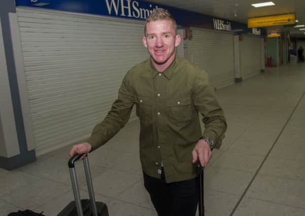 Jonny Hayes arrives at Glasgow airport ahead of his move to Celtic. Picture: Craig Foy/SNS