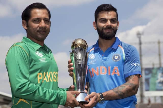 Pakistans captain Sarfraz Ahmed, left, with his Indian opposite number Virat Kohli, will battle to keep hold of the ICC trophy at the Oval today. Photograph:  AP