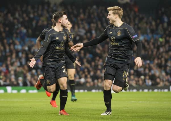 Celtic fans will hope for more moments like this, as Patrick Roberts, left, and Stuart Armstrong celebrate the wingers goal  away to Manchester City last season. Picture: SNS