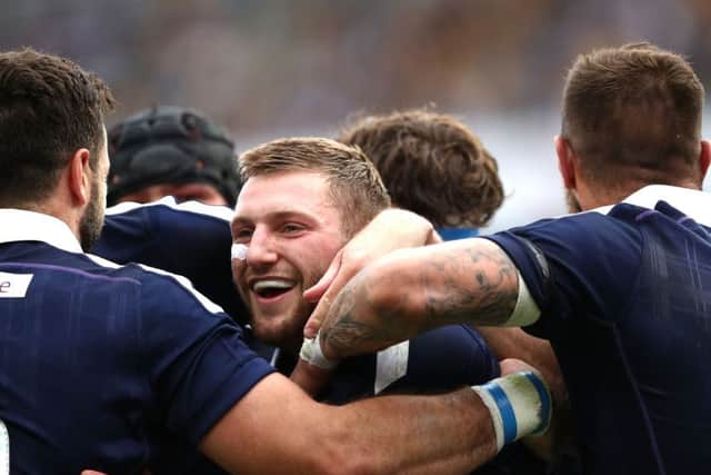 inn Russell celebrates his try against Australia. Picture: Getty.