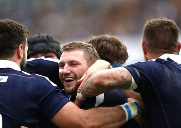 inn Russell celebrates his try against Australia. Picture: Getty.