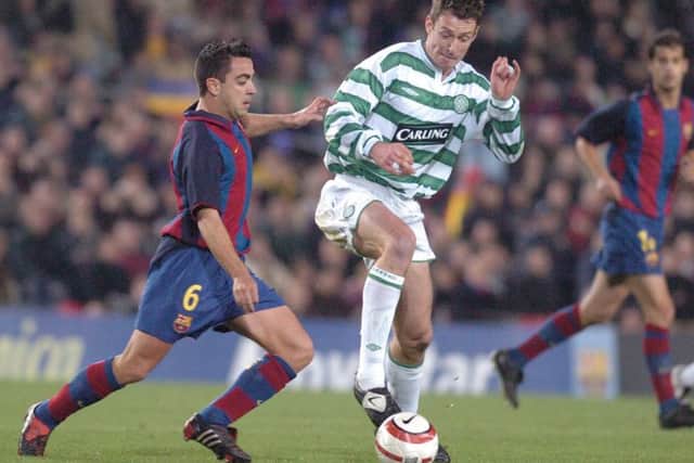 Xavi, left, squaring off against Celtic in 2004. Picture: Neil Hanna