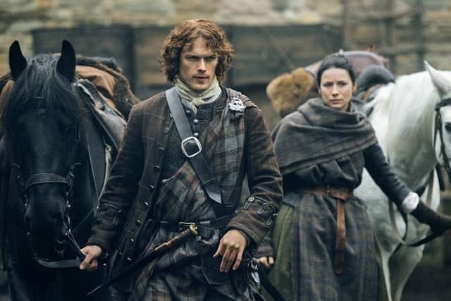 Sam Heughan as Jamie Fraser and Cagtriona Balfe as Claire Fraser