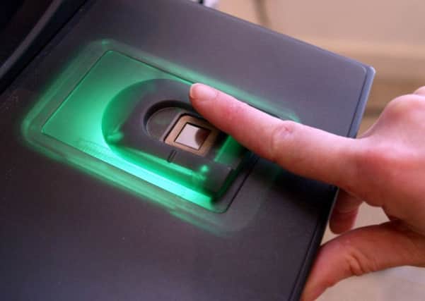 Fingerprint recognition and other 'biometric' data can help to improve security. Picture: Martin Cleaver/AP