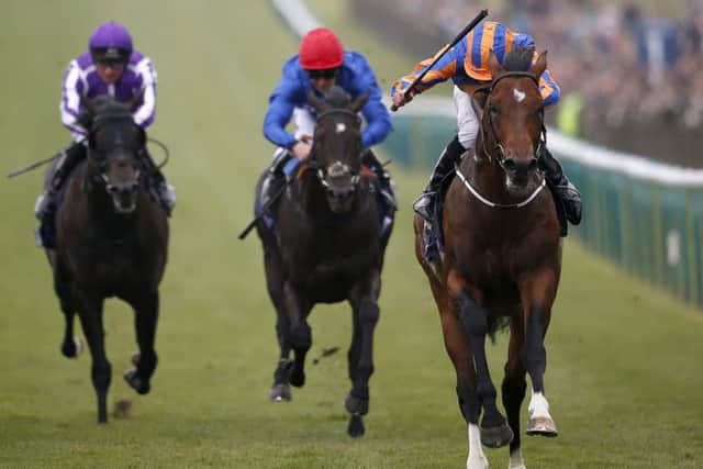 Churchill, right, with Ryan Moore aboard, storms home to win the 2,000 Guineas at Newmarket. Picture: Alan Crowhurst/Getty Images