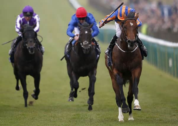 Churchill, right, with Ryan Moore aboard, storms home to win the 2,000 Guineas at Newmarket. Picture: Alan Crowhurst/Getty Images