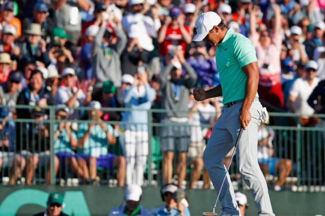 Brooks Koepka celebrates on the 18th green after clinching the US Open at Erin Hills.