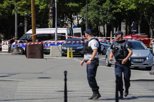 Police officers walk accross a sealed off area on June 19, 2017 on the Champs-Elysees. Picture: AFP/Getty