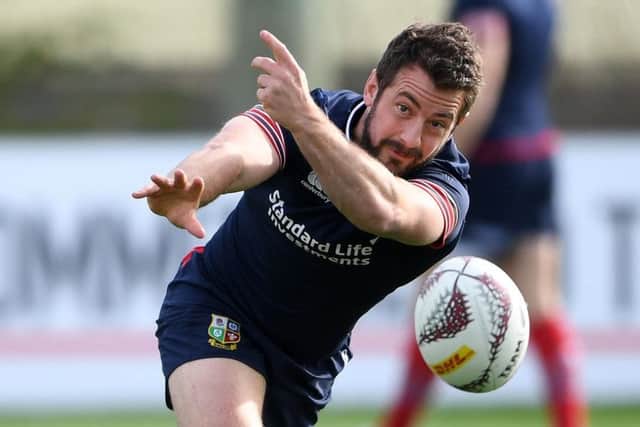 Scrum-half Greig Laidlaw passes the ball in training ahead of the Lions' tour match against the Chiefs in Hamilton today. Picture: Fotosport/David Gibson