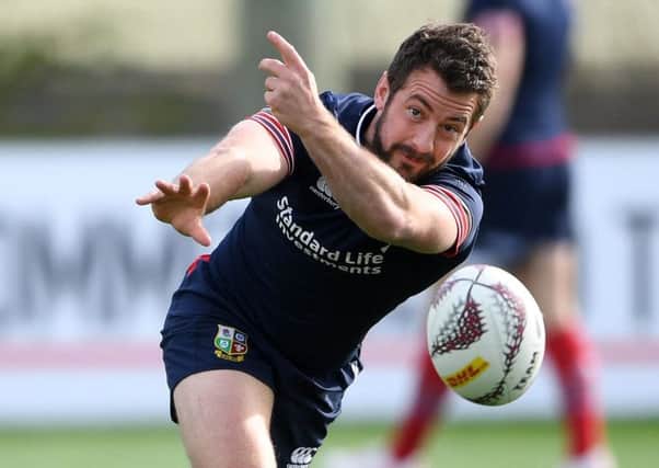 Scrum-half Greig Laidlaw passes the ball in training ahead of the Lions' tour match against the Chiefs in Hamilton today. Picture: Fotosport/David Gibson