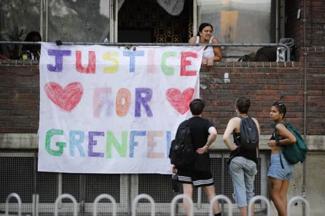 A banner with "Justice for Grenfell" is seen close to the scene of the tower block fire. Picture: AFP/Tolga Akmen/Getty Images