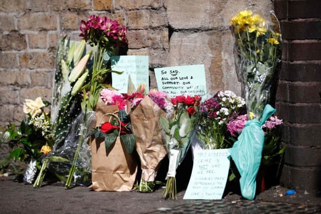 Flowers and tributes are pictured at a police cordon near the scene in Finsbury Park area of north London after a vehicle was driven into worshippers. Picture: Getty