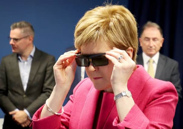 First Minister Nicola Sturgeon looks at a 3D simulator during a visit to the Advanced Forming Research Centre in Renfrewshire. Picture: Jane Barlow/PA Wire
