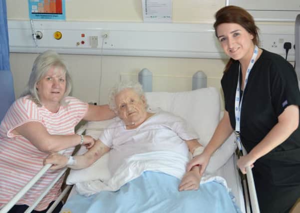 Yvonne Jeffery with her mum, dementia sufferer Mary Devanney, and Corinne Barrett, trauma liaison nurse practitioner at Wishaw General Hospital. Picture supllied