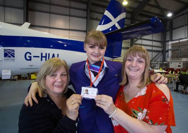 Loganair Cabin Crew Chloe Stott (centre) with her mum Katy Stott (right) and grandmother Freida Devin. Picture: PA