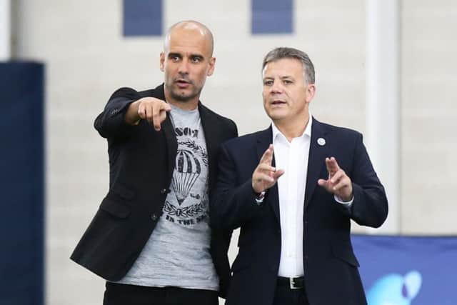 New Rangers director of football Mark Allen with Manchester City manager Pep Guardiola. Picture: PA Archive/PA Images