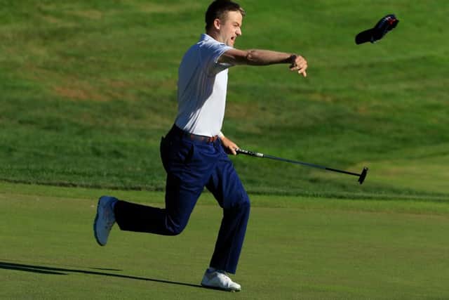 Russell Knox throws his cap in celebration on the 18th green after winning last year's Travelers Championship. Picture: Michael Cohen/Getty Images