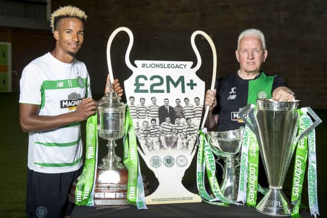 Celtic's Scott Sinclair and Lisbon Lion John Clark make the announcement that the Lions Legacy has raised £2 million for the Celtic Foundation. Picture: Alan Harvey/SNS