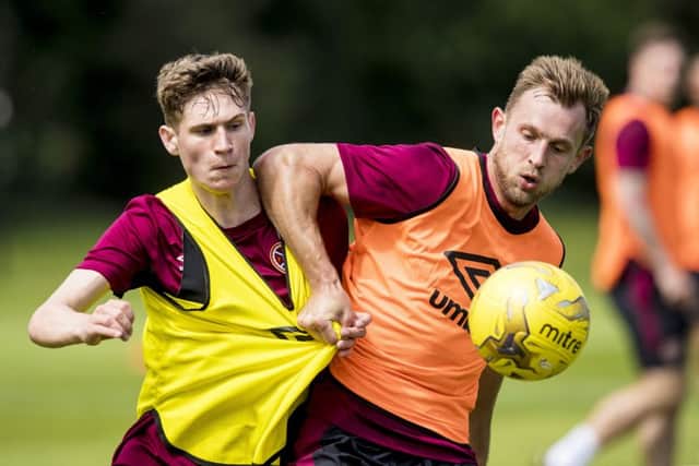 Rafal Grzelak, right, with youngster Rory Currie in Hearts training. Picture: SNS