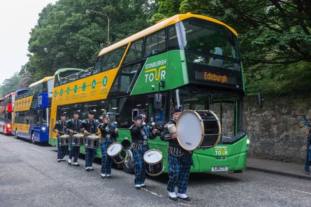 Edinburgh Bus Tours launch with Tattoo drummers in the Grassmarket. Picture: Steven Scott Taylor