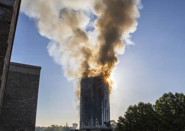 Smoke billows from a fire that has engulfed the 27-storey Grenfell Tower in west London.  Picture; PA