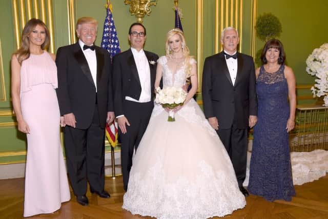 First Lady Melania Trump, President Donald Trump, Secretary of the Treasury Steven Mnuchin, Louise Linton, Vice President Mike Pence, and Second Lady Karen Pence pose at the wedding of Secretary of the Treasury Steven Mnuchin and Louise Lintonat Andrew Mellon Auditorium in Washington, DC. Picture: Kevin Mazur/Getty Images for LS