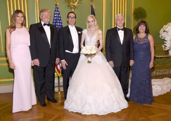 First Lady Melania Trump, President Donald Trump, Secretary of the Treasury Steven Mnuchin, Louise Linton, Vice President Mike Pence, and Second Lady Karen Pence pose at the wedding of Secretary of the Treasury Steven Mnuchin and Louise Lintonat Andrew Mellon Auditorium in Washington, DC. Picture: Kevin Mazur/Getty Images for LS