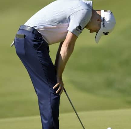 Russell Knox reacts to msising a birdie putt in his opening round. Picture: AP