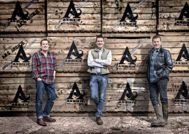 Brothers and co-founders of spirits maker Arbikie Iain, John and David Stirling at their distillery near Inverkeilor, north of Arbroath. Photograph: Chris Close