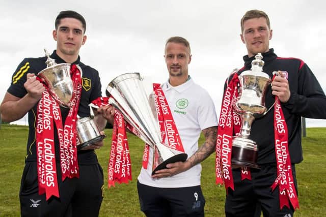 Livingston's Jackson Longridge, Celtic's Leigh Griffiths, and Arbroath's Colin Hamilton help launch the Ladbrokes Premiership, League 1, and League 2 fixtures for the upcoming season. Picture: SNS