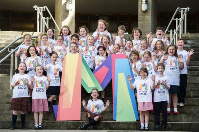 Donald Iain Brown, chair of MÃ²d Ghlaschu 2019, is joined by school children from Gaelic School Glasgow to unveil the new logo for the festival. Picture: John Devlin/TSPL