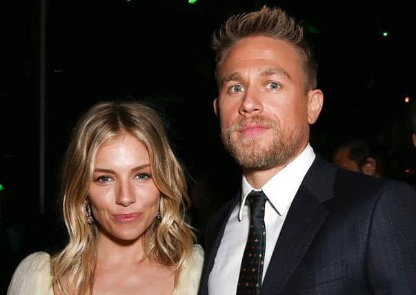 Sienna Miller pictured with Lost City of Z co-star Charlie Hunnam. Picture: Getty Images