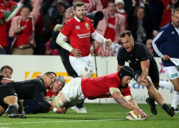 British and Irish Lions Sean O'Brien dives over to score a try during their Test match against New Zealand. Picture: MICHAEL BRADLEY/AFP/Getty Images