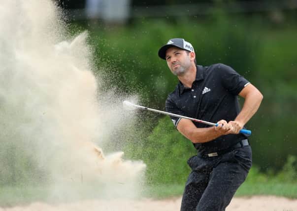 Sergio Garcia plays out of a bunker on his way to a 67 at Golfclub Munchen Eichenried.  Photograph: Warren Little/Getty Images