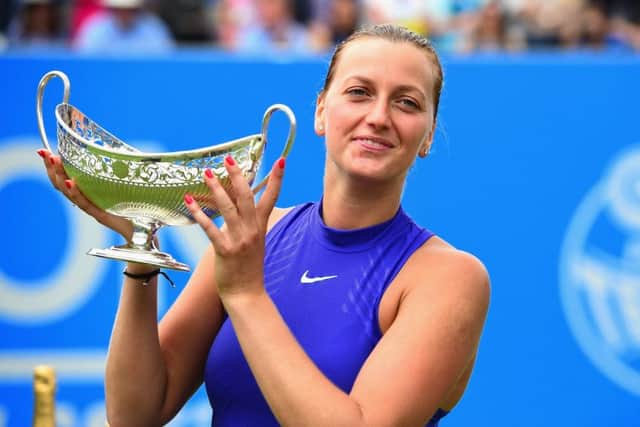 Petra Kvitova raises the trophy after winning the Aegon Classic title in Birmingham yesterday. Picture: Getty.