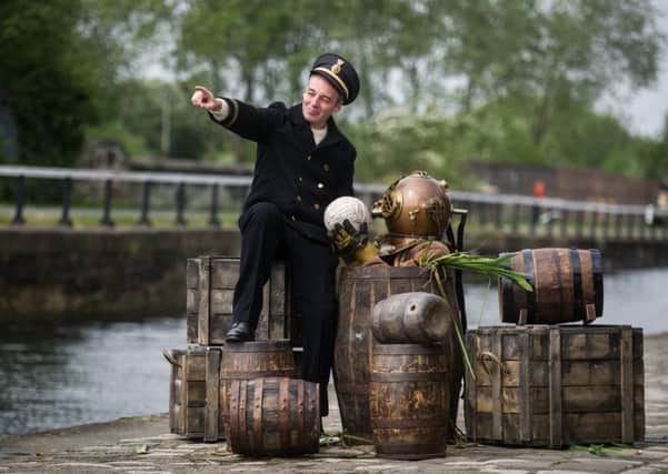 Alan McHugh and friend on the banks of the Forth and Clyde Canal for Submarine Time Machine, a site-specific performance from the National Theatre of Scotland